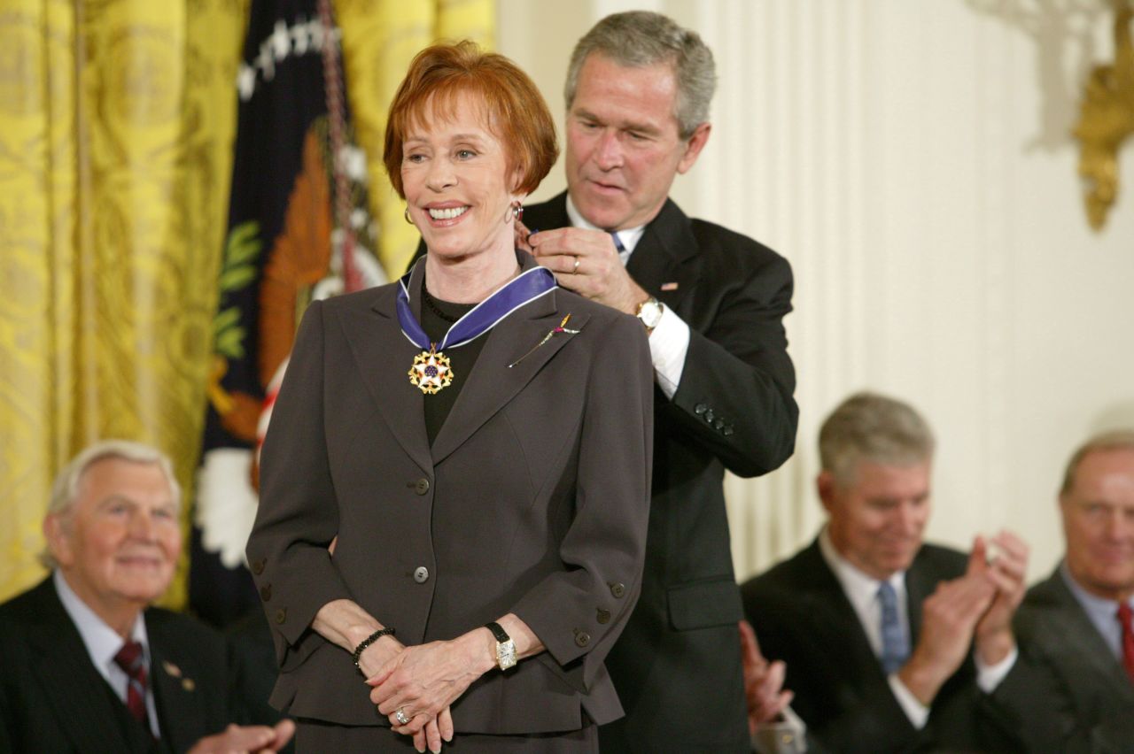 President George W. Bush awards Burnett the Presidential Medal of Freedom in 2005. Burnett was honored "for enhancing the lives of millions of Americans and for her extraordinary contributions to American entertainment."