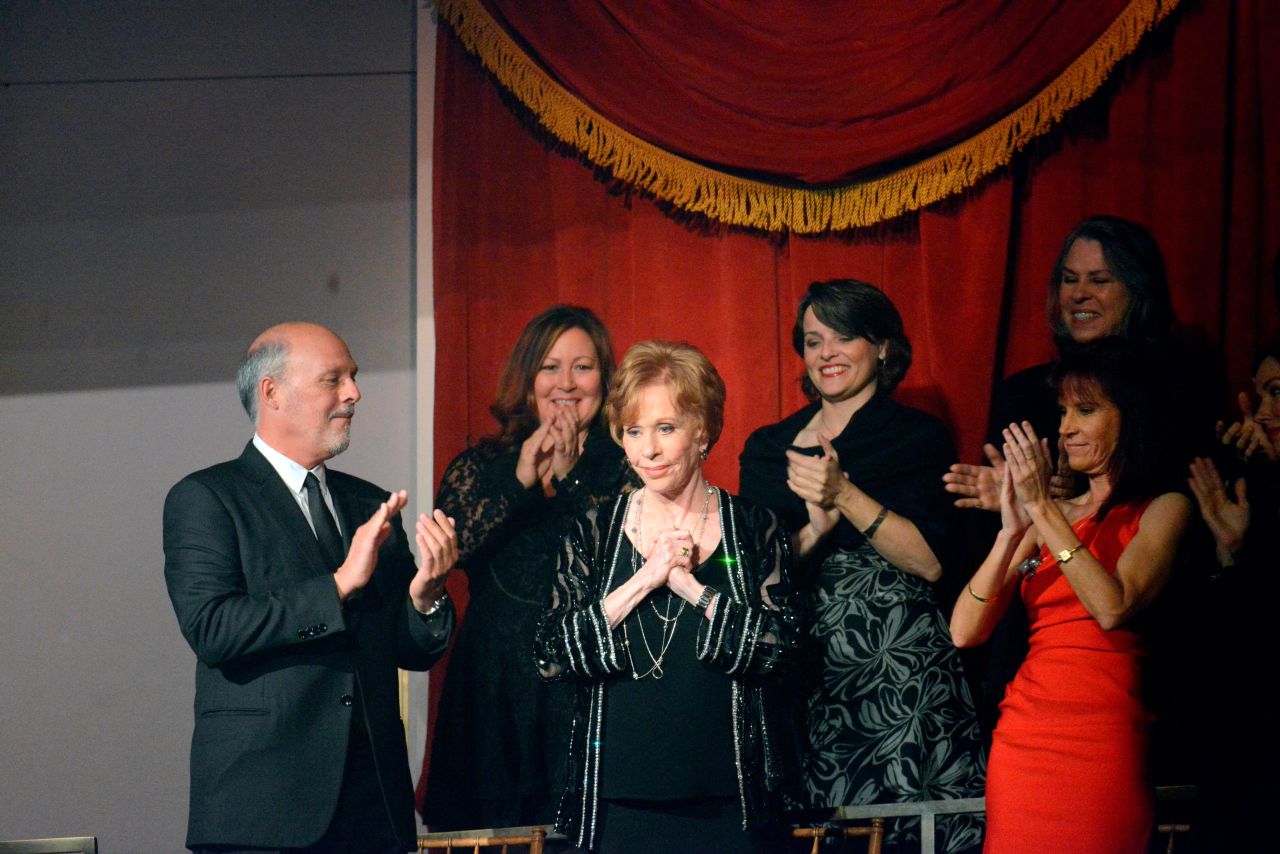 Burnett is honored with the Kennedy Center's Mark Twain Prize for American Humor in 2013. Joining her in the front row is her husband, Brian Miller.
