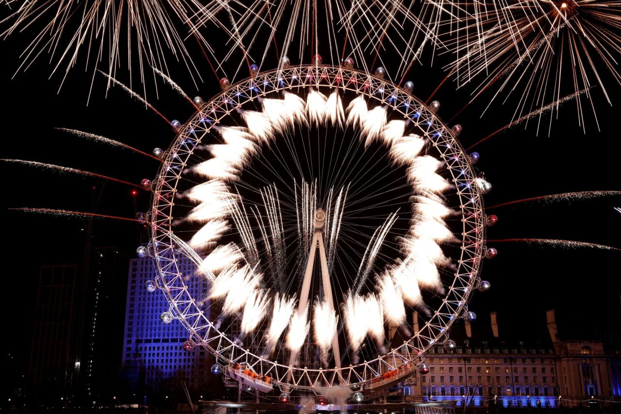 Fireworks explode around the London Eye in London.