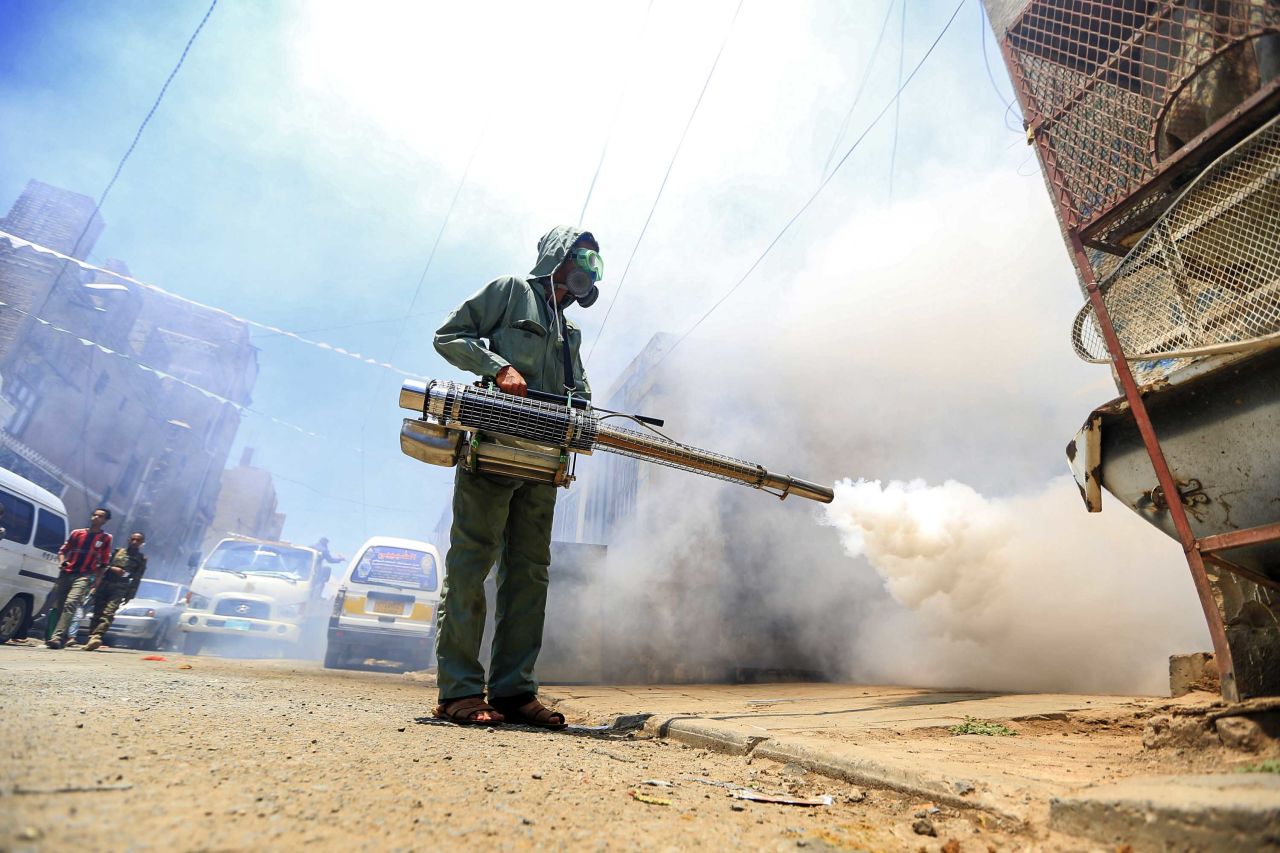 A local administration worker fumigates a neighbourhood in Yemen's capital, Sanaa, on March 23.