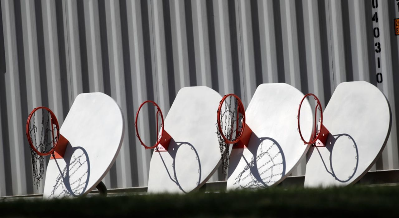 Basketball hoops and backboards, removed from city parks, sit in a row outside a storage facility as a statewide stay-at-home order remains in effect in an effort to reduce the spread of the virus on Monday, April 6, in Wheat Ridge, Colorado. 