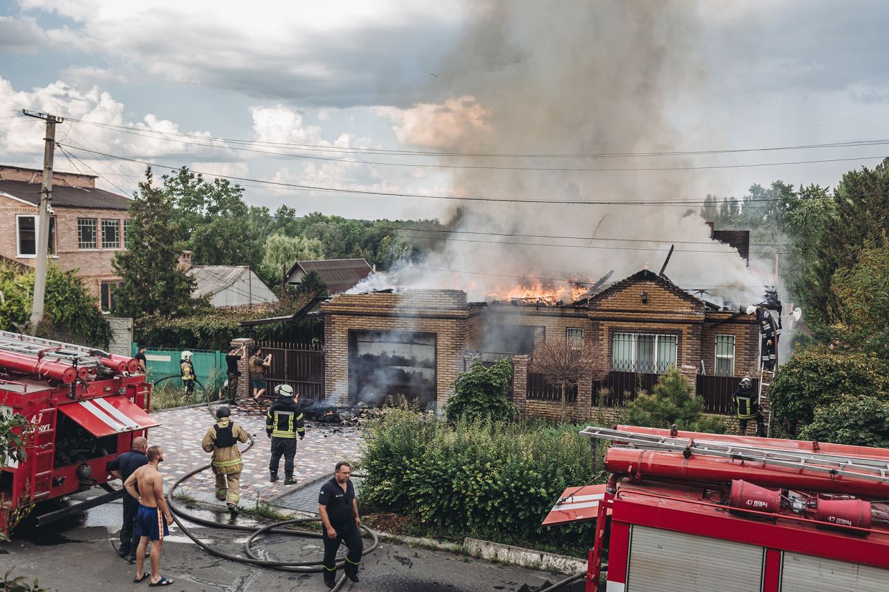 Firefighters extinguish a fire on a home that was shelled in the city of Bakhmut, Ukraine on July 28. 