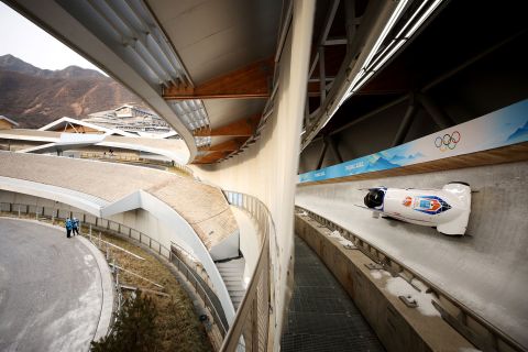 Dutch bobsledders slide during training for the two-man event on February 11.