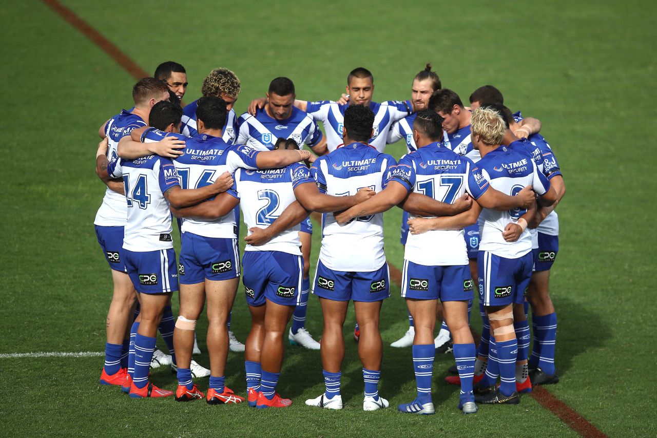 Canterbury Bulldogs players observe a moment of silence before their Rugby League match in Auckland, New Zealand on Saturday.