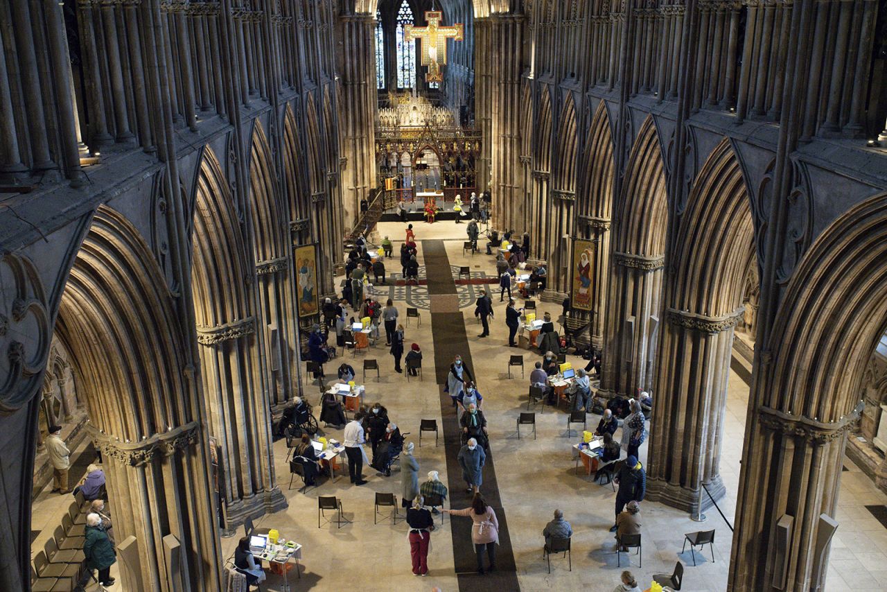 Members of the public receive the Oxford/AstraZeneca coronavirus vaccine at Lichfield Cathedral, in Staffordshire, England, on Friday, January 15.