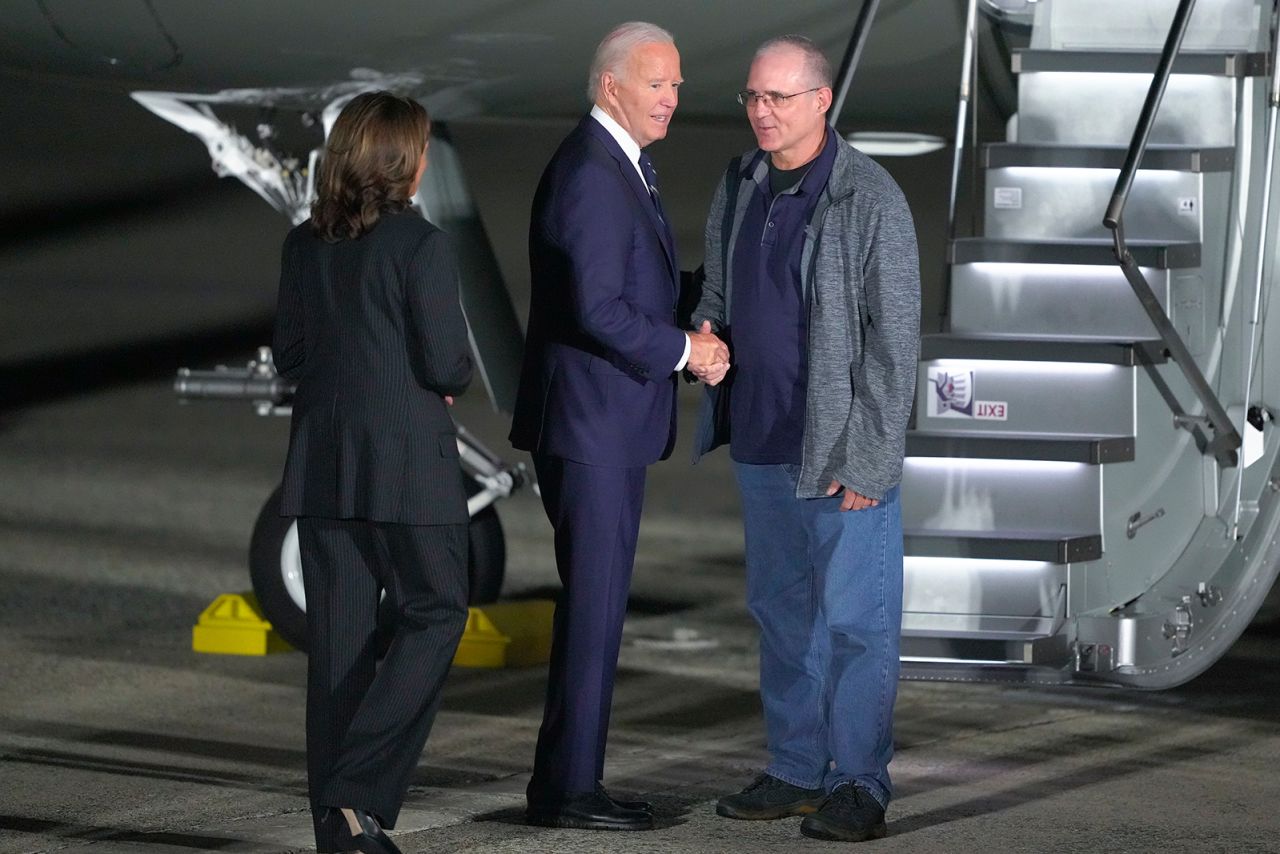 President Joe Biden and Vice President Kamala Harris greet Paul Whelan Joint Base Andrews on Thursday.