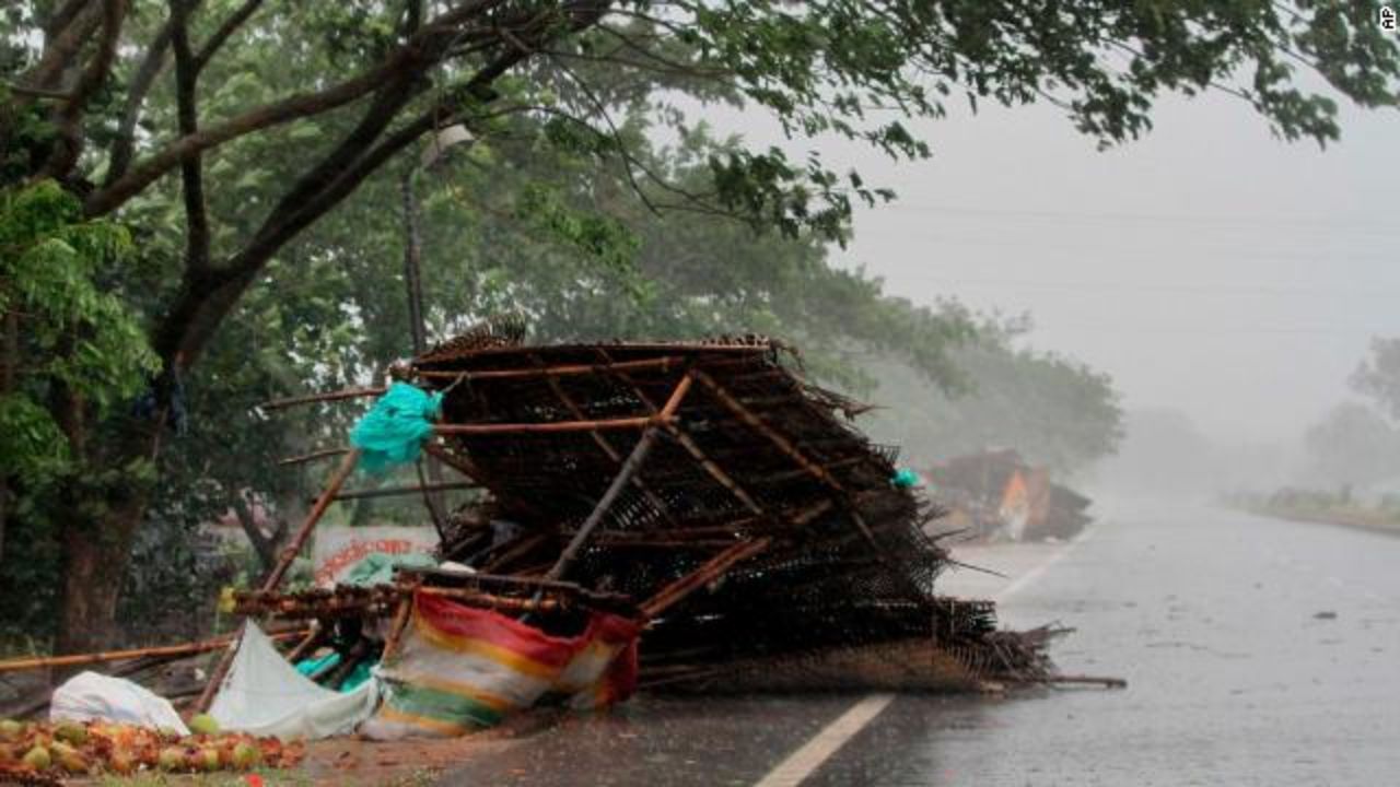 Winds from the approaching storm leave a street stand blown over near Puri on May 3