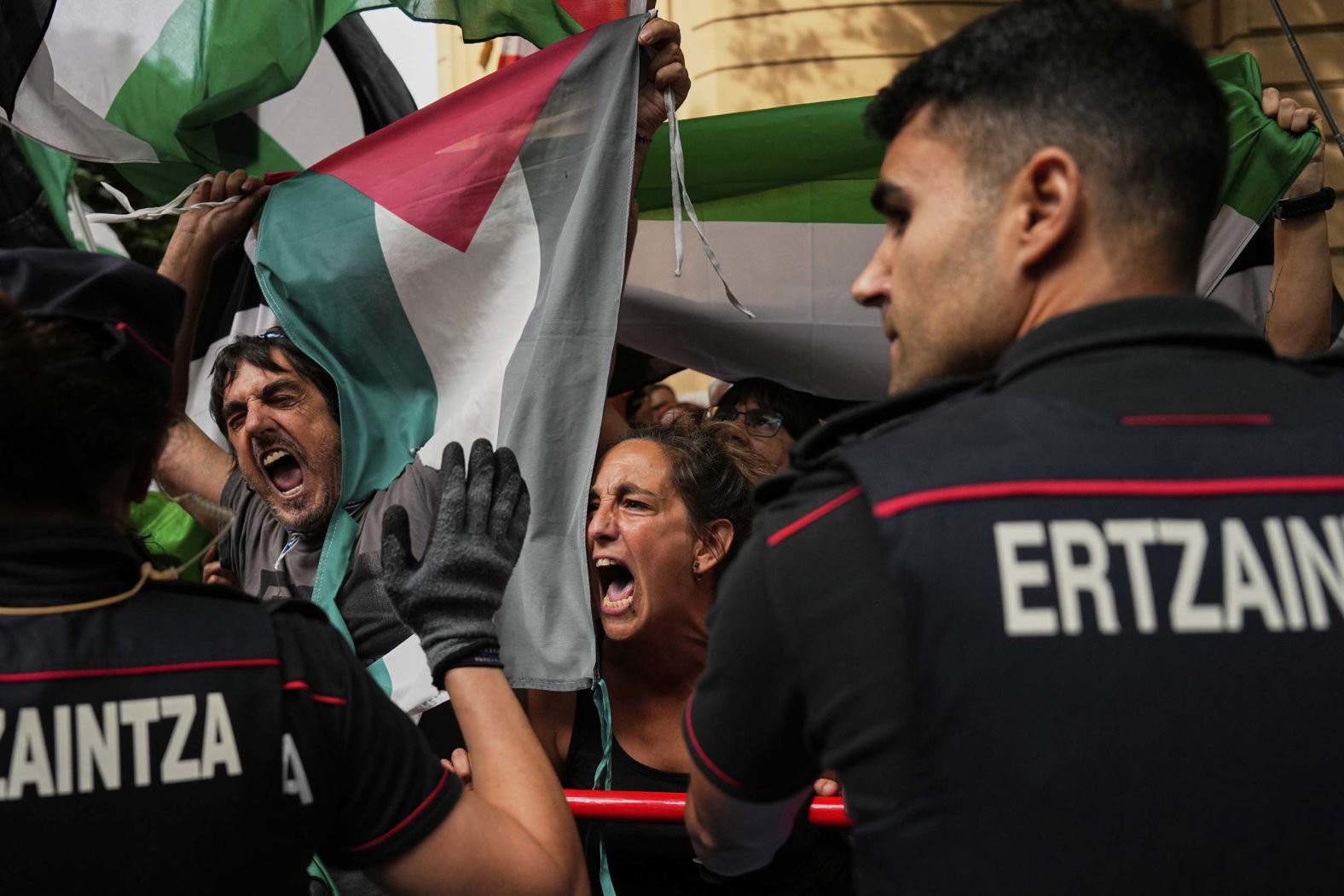 Protesters hold Palestinian flags as they <a href="index.php?page=&url=https%3A%2F%2Fwww.cnn.com%2F2025%2F09%2F03%2Fsport%2Fcycling-vuelta-protesters-disrupt-race">disrupt the 11th stage of the Vuelta a España cycling race</a> on Wednesday, September 3. Race organizers ordered the race to finish three kilometers short of the finish line in Bilbao, Spain.