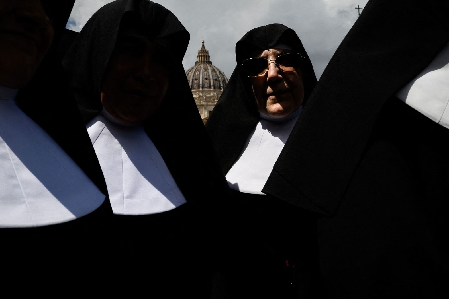 Nuns walk in St. Peter's Square at the Vatican on Wednesday, May 7.