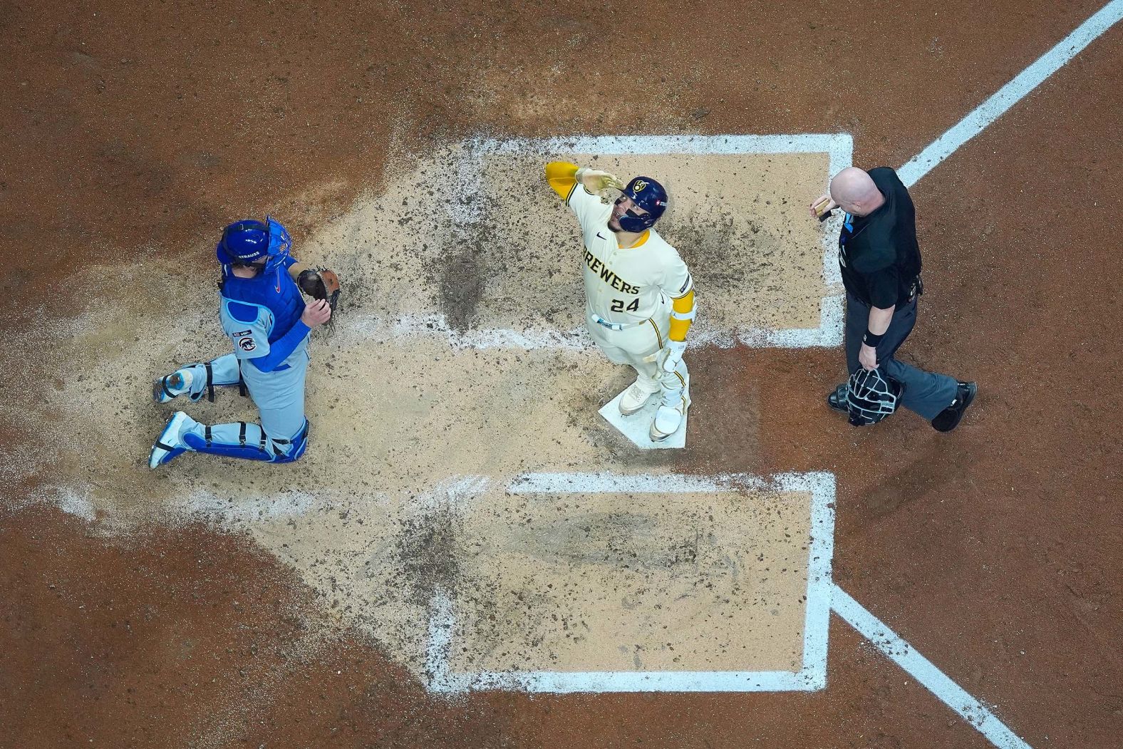 The Milwaukee Brewers' William Contreras crosses home plate after hitting a solo home run against the Chicago Cubs during Game 2 of the National League Division Series on Monday, October 6. The Brewers won to take a 2-0 series lead.