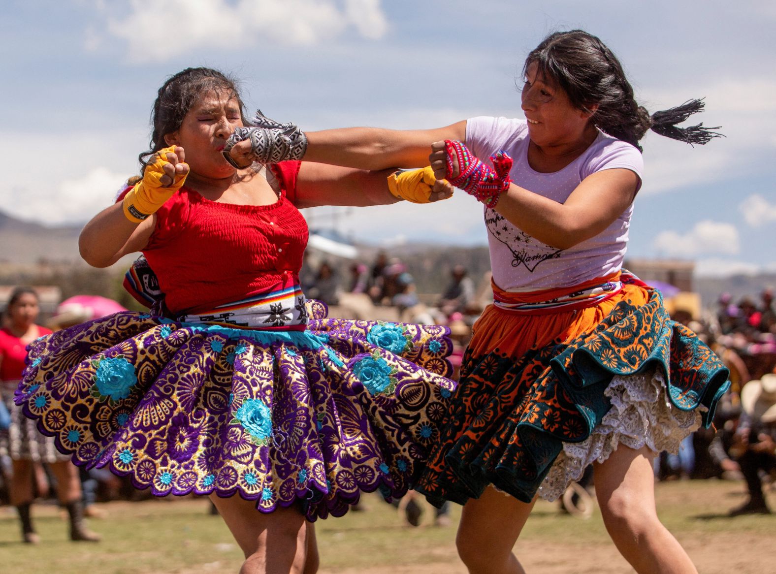 Women fight at the annual Takanakuy festival in Llique, Peru, on Thursday, December 26. Takanakuy means to "hit each other" in Quechua, and the fighting is meant to resolve conflicts and strengthen relationships.