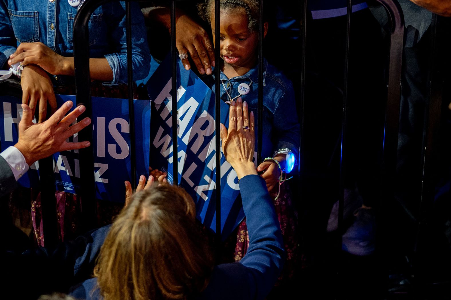 US Vice President Kamala Harris greets a young girl at a campaign rally in Philadelphia on Tuesday, August 6.