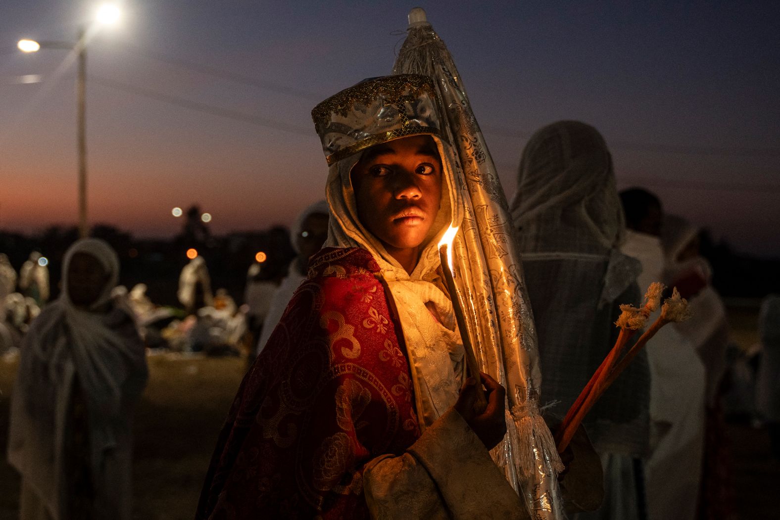 An Ethiopian Orthodox deacon holds a candle while celebrating the the Ethiopian Orthodox Epiphany in Addis Ababa on Sunday, January 19.