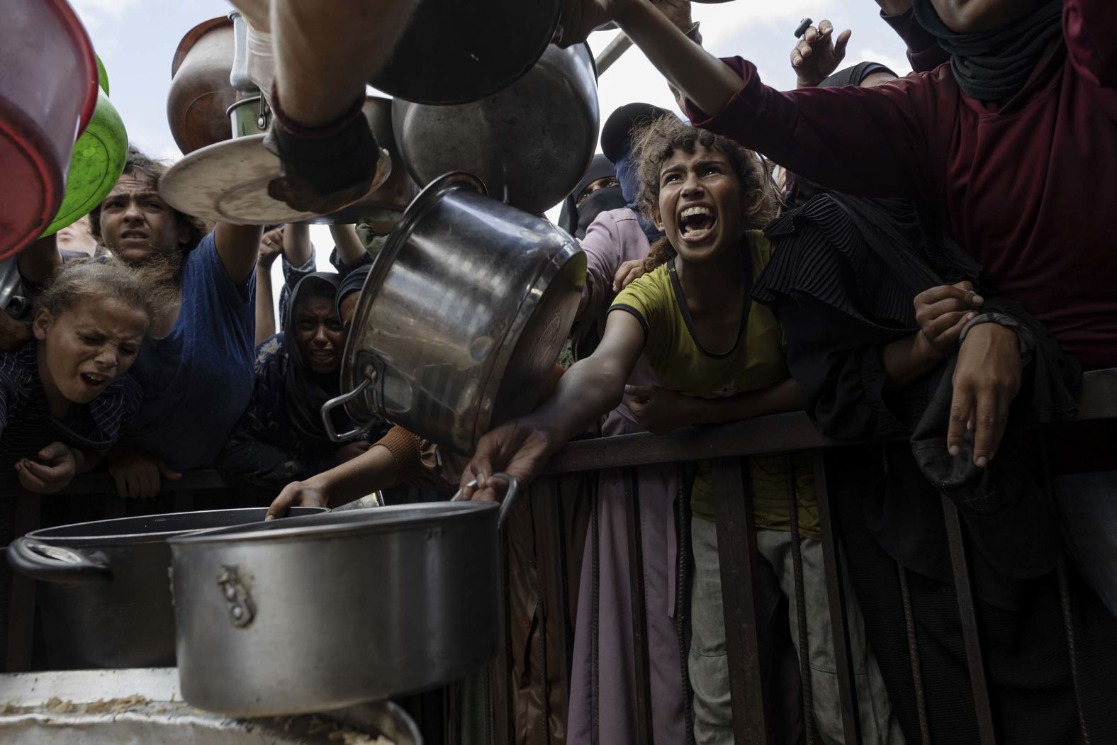 Palestinians at a charity kitchen outside a displacement camp in Khan Yunis, Gaza, on Sunday, Sept. 21, 2025. (Saher Alghorra/The New York Times)