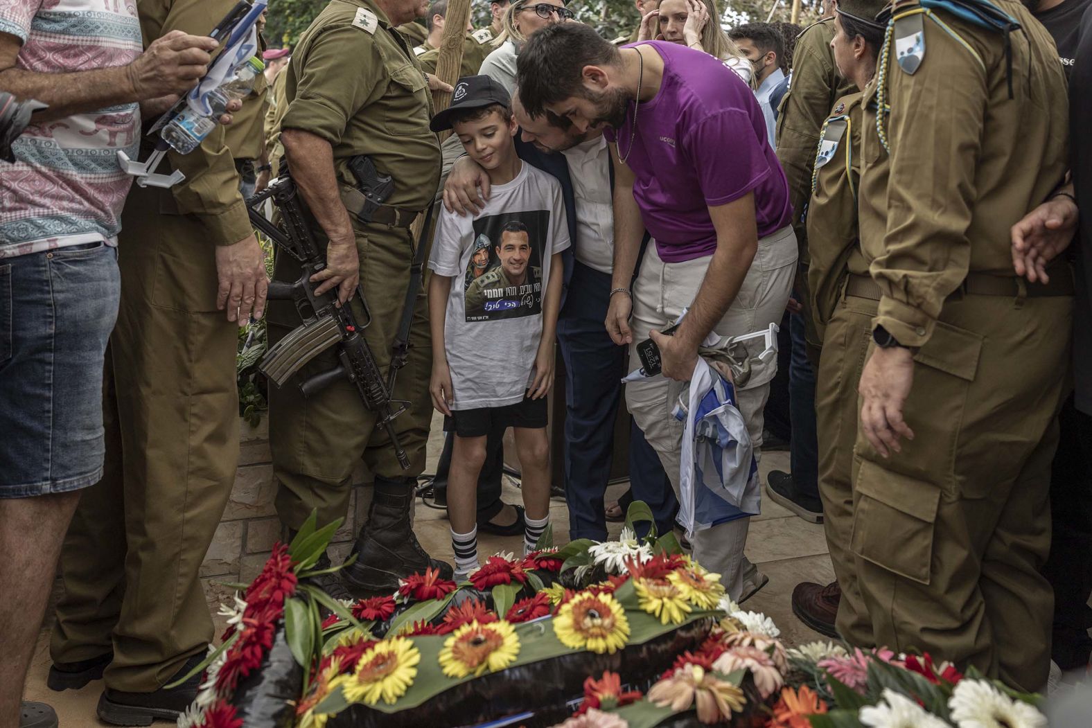 Alon Hamami, the young son of Israeli Col. Asaf Hamami, attends his father's funeral at a military cemetery in Tel Aviv, Israel, on Tuesday, November 4. Hamami, 40, was killed in combat on October 7, 2023. <a href="index.php?page=&url=https%3A%2F%2Fwww.cnn.com%2F2025%2F11%2F02%2Fmiddleeast%2Figaza-deceased-hostages-return-israel-latam-intl">His body was returned by Hamas</a> as part of its ceasefire deal with Israel.