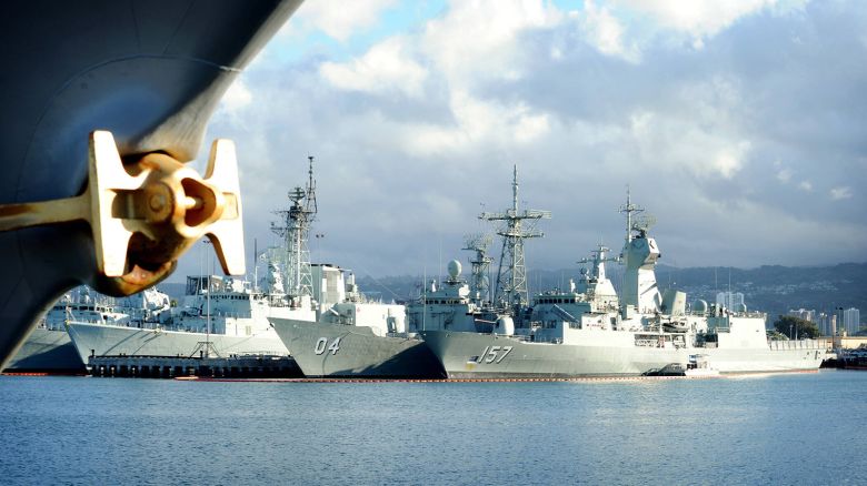 The Royal Australian Navy Adelaide-class guided-missile frigate HMAS Darwin FFG 04 and the Royal Australian navy Anzac-class frigate HMAS Perth FFH 157 are pierside at Joint Base Pearl Harbor-Hickam during Rim of the Pacific RIMPAC on July 2, 2012.