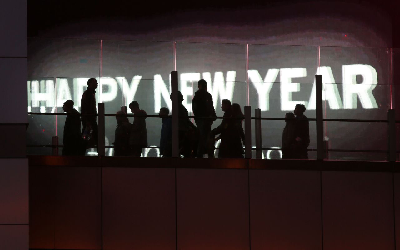 People walk along a pedestrian bridge in Las Vegas.