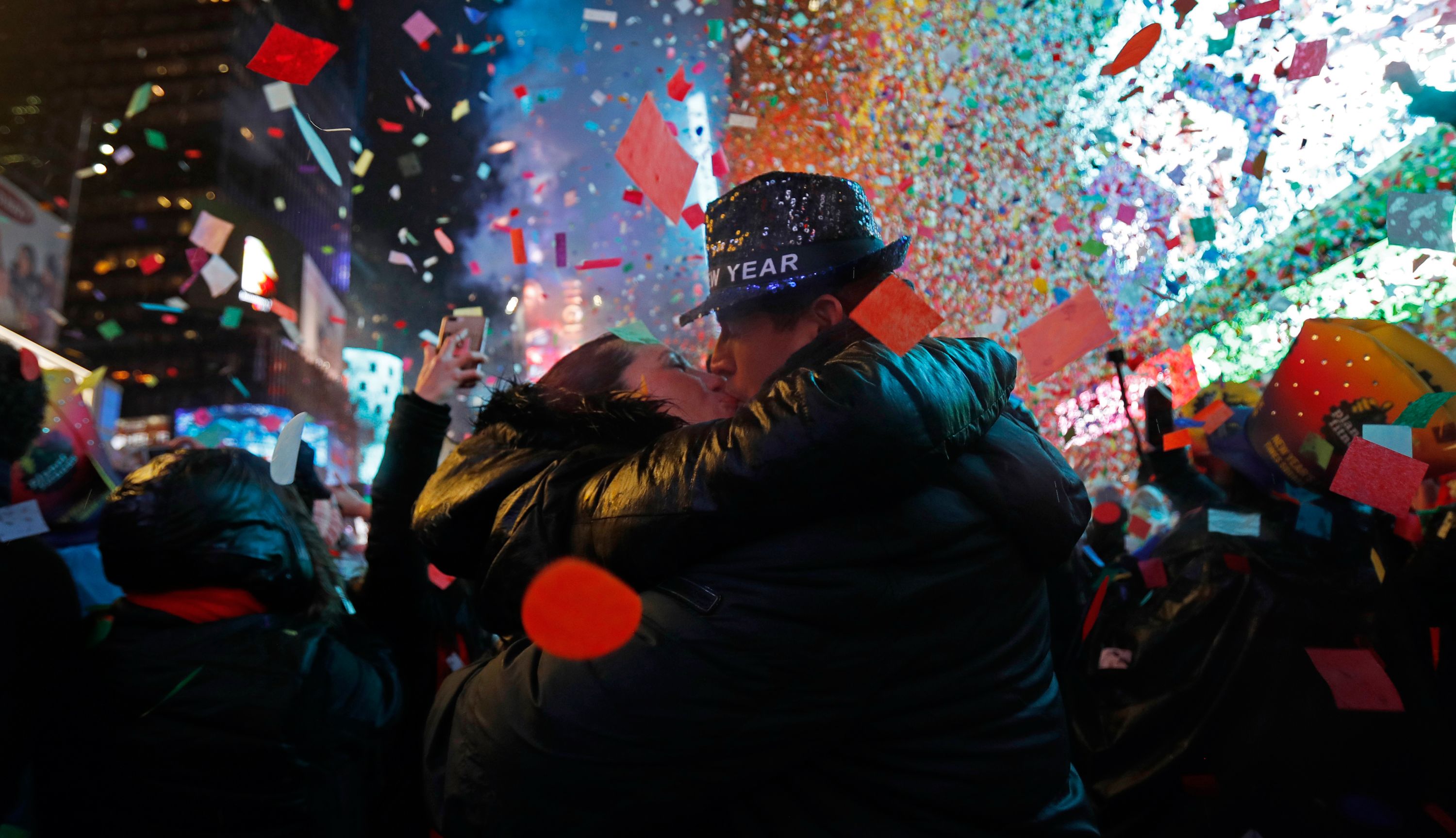 Joey and Claudia Flores of California kiss as confetti falls during New Year's celebrations in New York's Times Square.