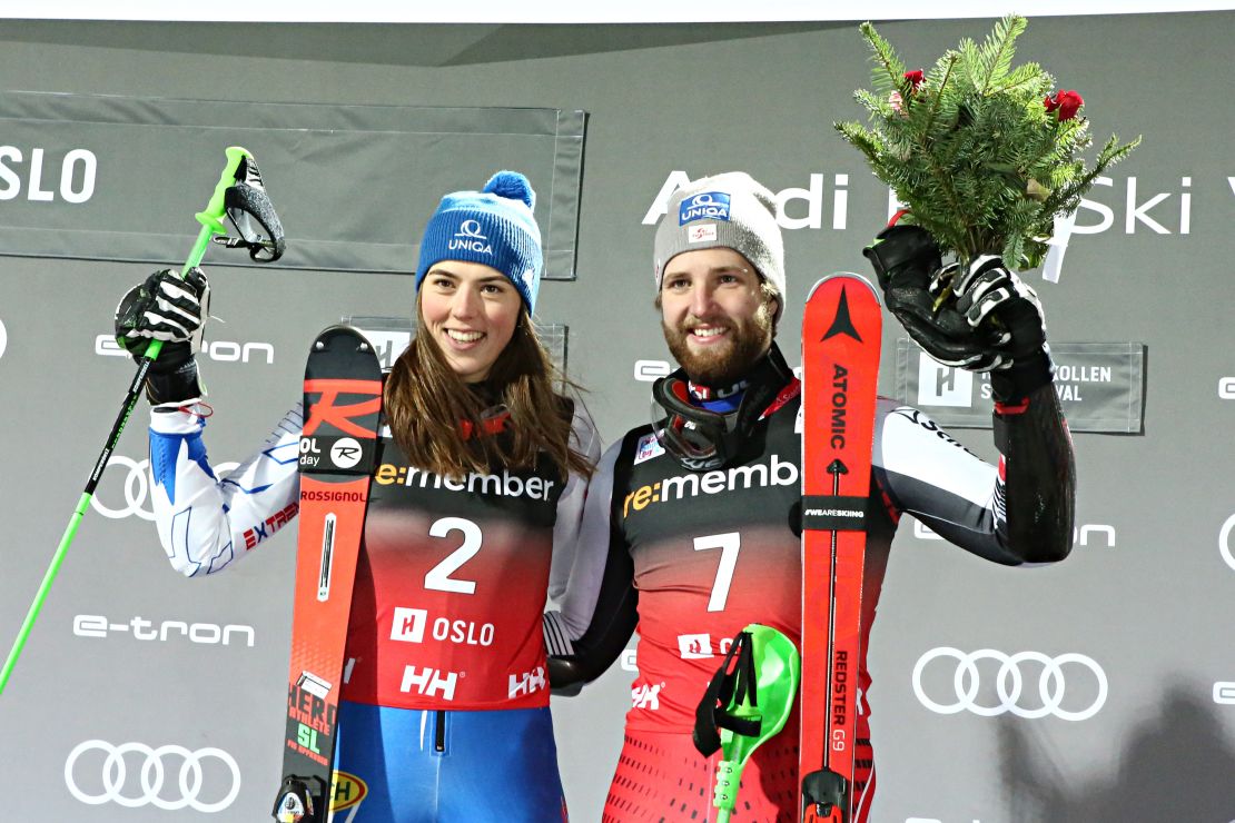 Petra Vlhova of Slovakia shares the podium with Austria's Marco Schwarz who was claiming his first World Cup victory.
