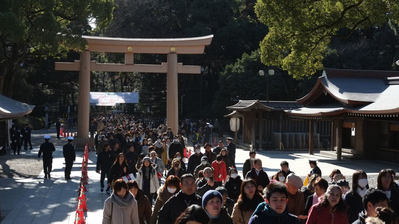 People make their way to offer prayers on the first day of the new year at Meiji Shrine in Tokyo.