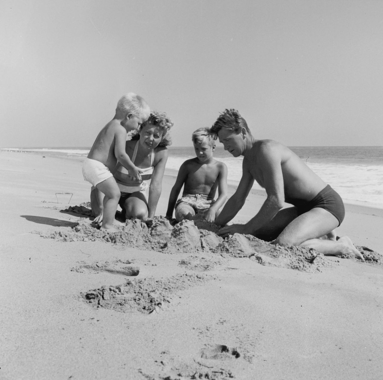 Bridges, seen on the left as a young boy, plays in the sand with his family. Bridges was born in Los Angeles in 1949. Both of his parents, Lloyd and Dorothy, were actors. His older brother, Beau, also became an actor.