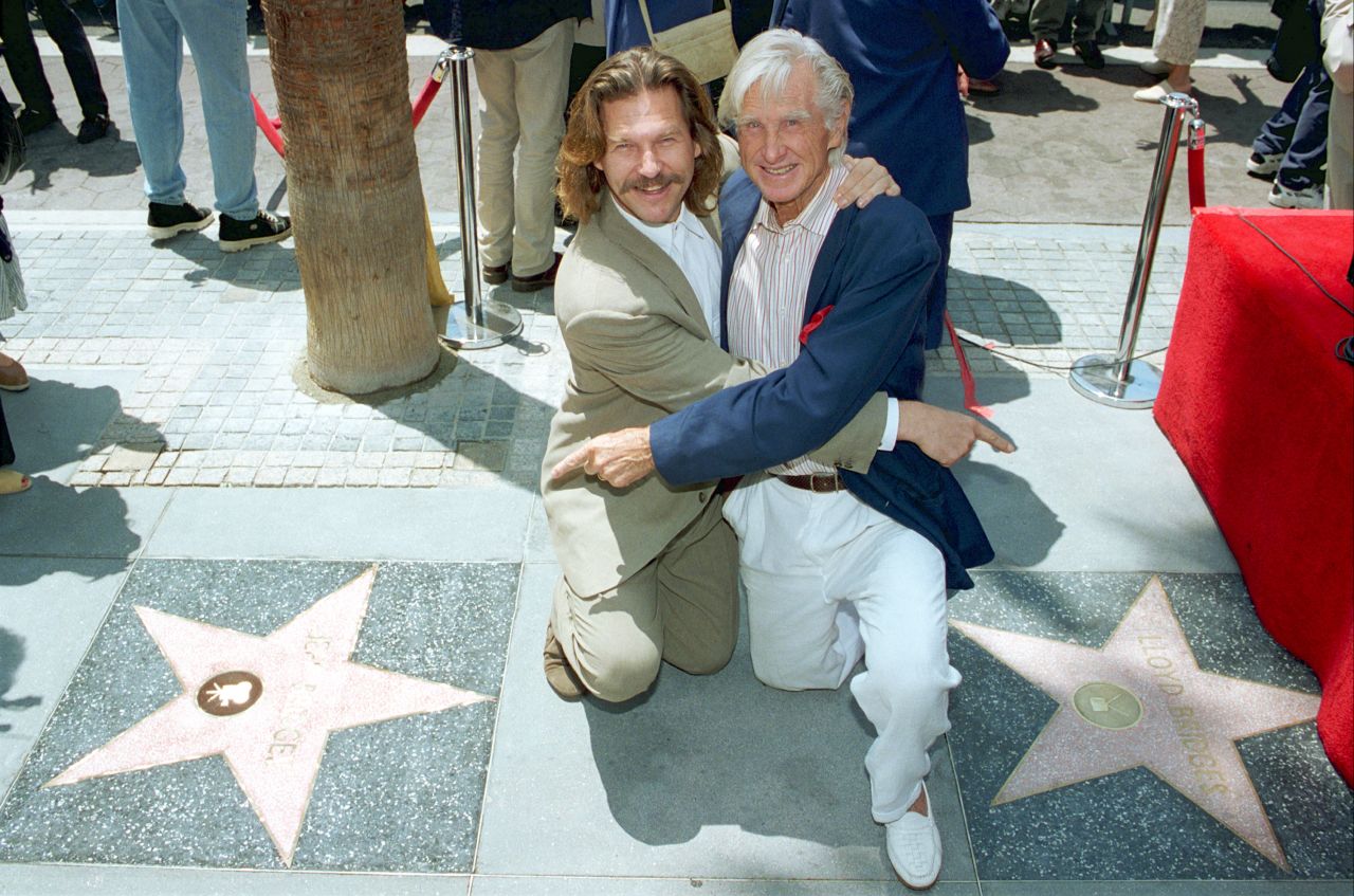 Bridges and his dad point to each other's star on the Hollywood Walk of Fame in 1994.