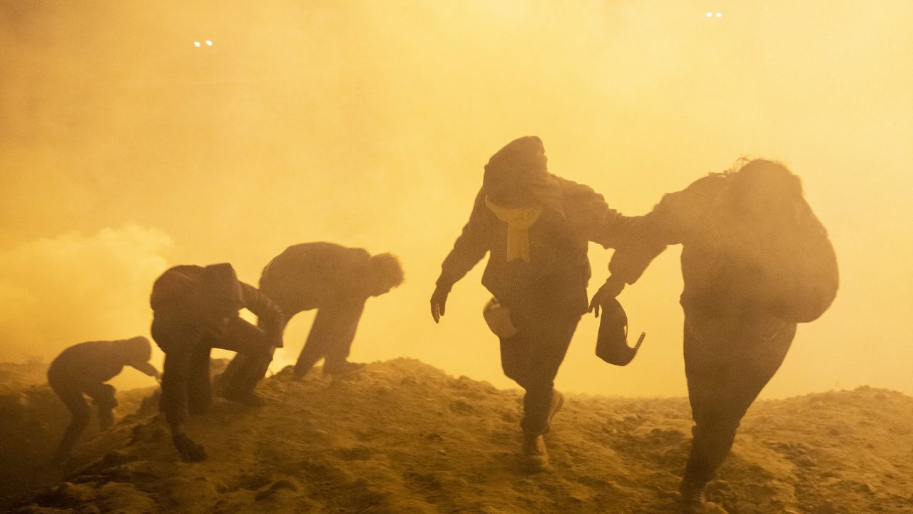 People flee after US agents employed gas and smoke at the border with Mexico.