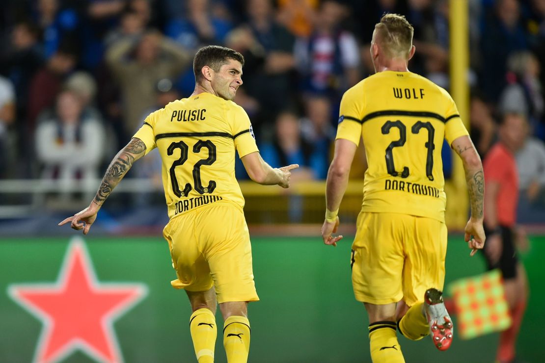 Pulisic celebrates scoring against Club Brugge in the Champions League. 