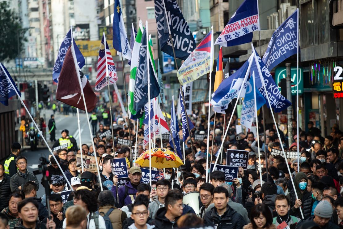 A group of Hong Kong independence supporters display flags during the annual New Year's Day pro-democracy rally in Hong Kong on January 1, 2019.