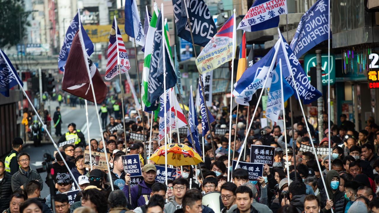 A group of Hong Kong independence supporters display flags during the annual New Year's Day pro-democracy rally in Hong Kong on January 1, 2019.