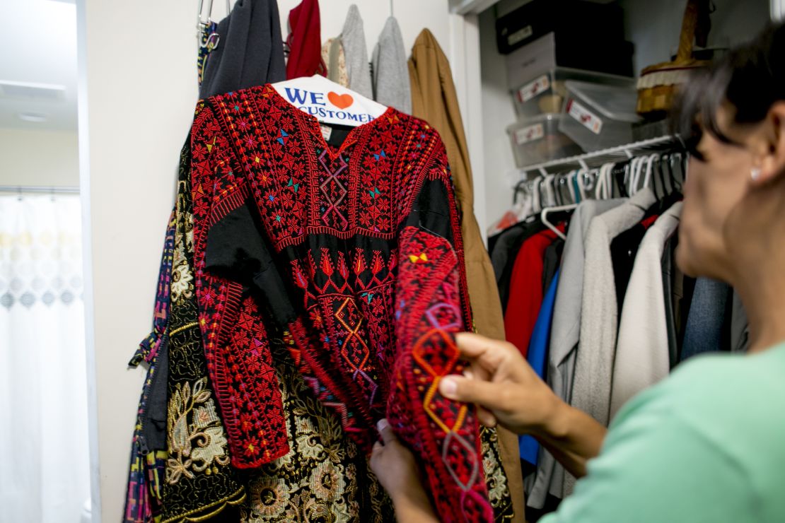 Rashida Tlaib shows her mother's thobe, a traditional Palestinian dress, in Detroit on August 10, 2018.