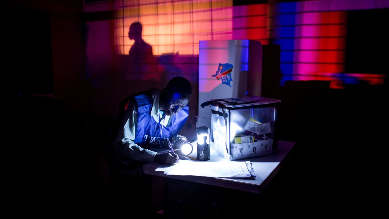 An Electoral Agent closes a voting station ahead of counting the ballots after the Democratic Republic of the Congo's Presidential elections on December 30, 2018 in Kinshasa.