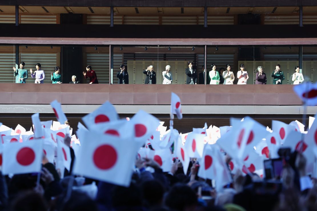 Japan's Emperor Akihito, Empress Michiko and members of the royal family wave to the crowd during the New Year's greeting ceremony.