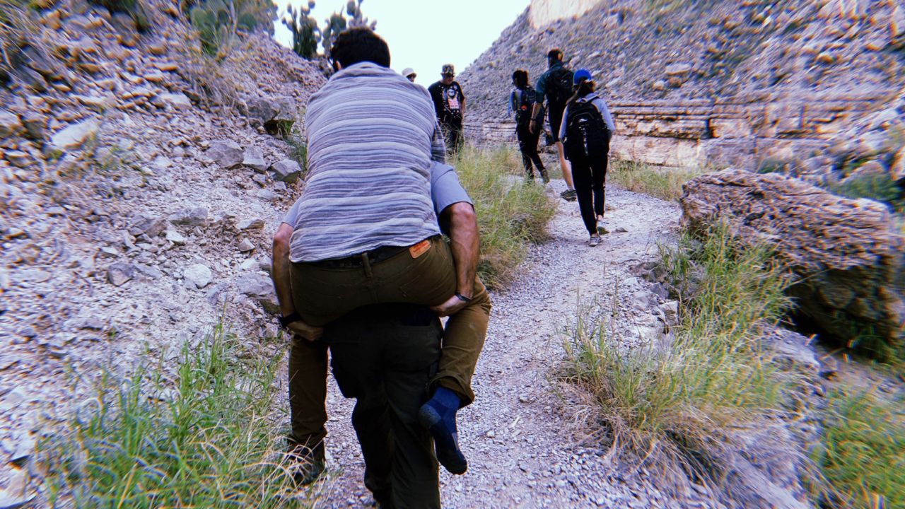 A park ranger helped carry Josh Snider out of a canyon.