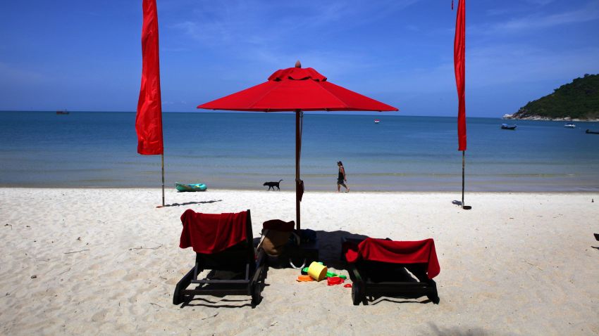 KOH PHANGAN THAILAND - JUNE 18:  A white sand beach decorated by red umbrellas at the Anantara Rasananda resort  June 18, 2012 on the island of Koh Phangan off the coast of Koh Samui . Thailand's official tourism body, the Tourism Authority of Thailand (TAT) has set itself the ambitious target of attracting more than 20 million tourists in 2012. According to TAT, In April, Thailand welcomed 1,659,021 international tourists which is a slight increase of 6.87% over the same in 2011.  (Photo by Paula Bronstein/Getty Images)
