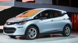 The Chevrolet Bolt drives onstage during a press conference at the 2017 North American International Auto Show in Detroit, Michigan, January 9, 2017. / AFP / Geoff Robins        (Photo credit should read GEOFF ROBINS/AFP/Getty Images)