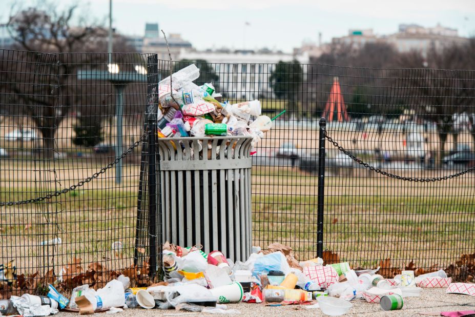 Garbage overflows from a trash can on the National Mall, across from the White House, on Tuesday, January 1. The National Park Service, which is responsible for trash removal, was not operating because of the government shutdown.