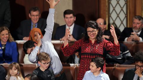 Rashida Tlaib wears a traditional Palestinian gown, as her son does a dance move, the dab.