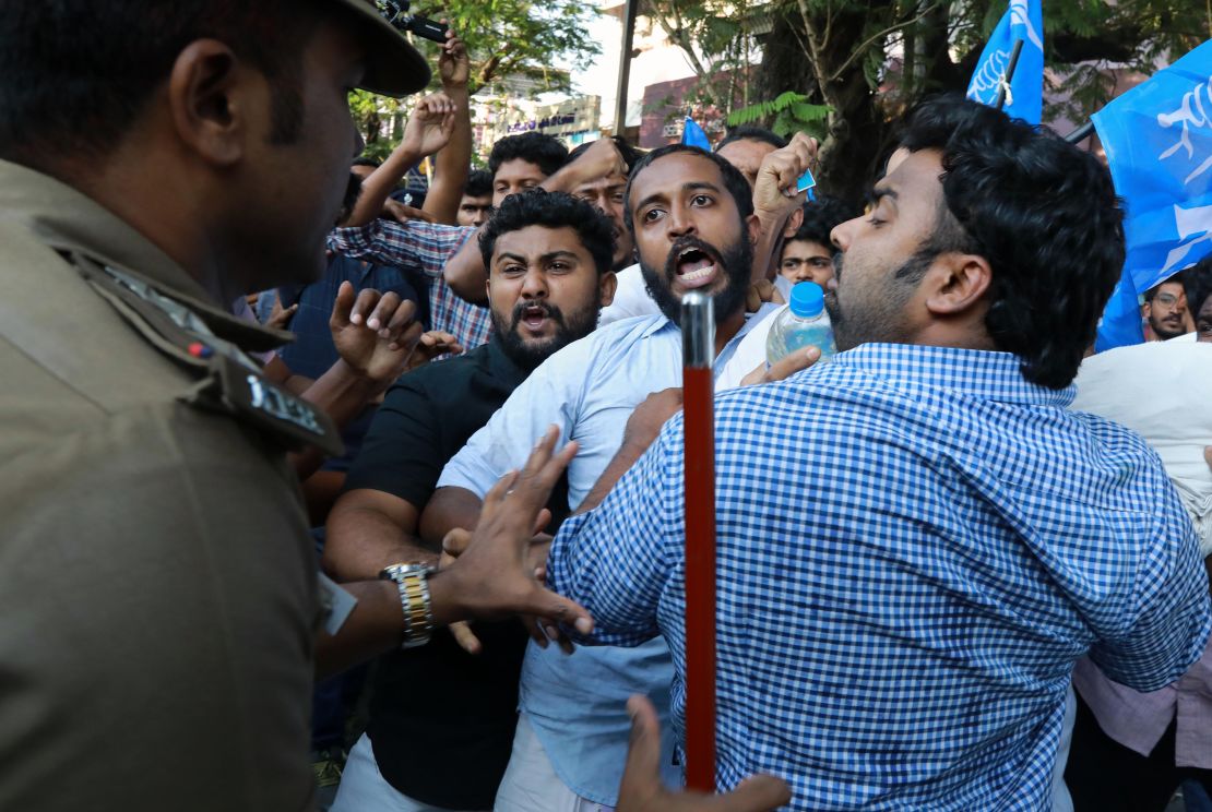 Kerala police attempt to disperse crowds protesting against women entering the temple. 