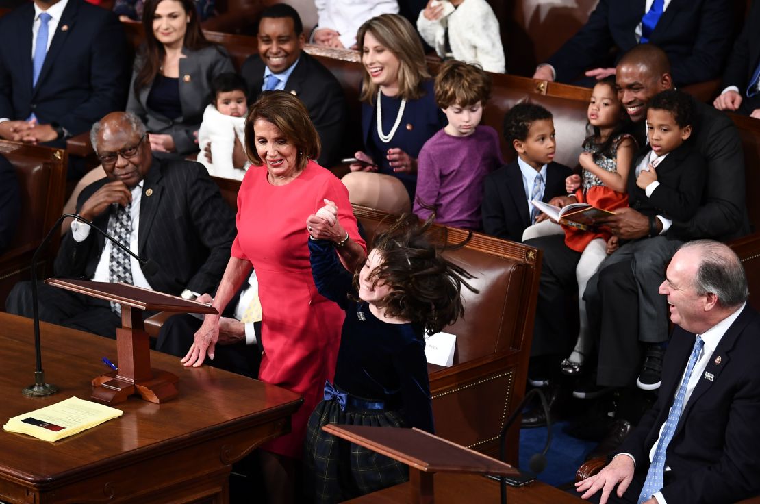 Katie Hill laughs as Nancy Pelosi's granddaughter reacts to votes for Pelosi to become Speaker of the House.