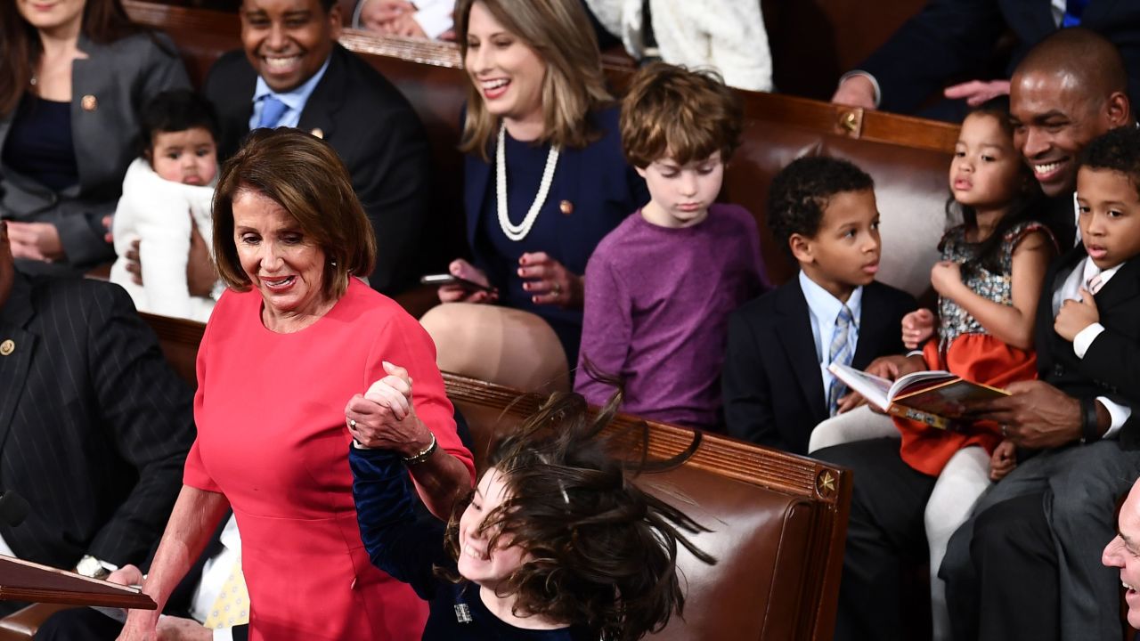 Katie Hill laughs as Nancy Pelosi's granddaughter reacts to votes for Pelosi to become Speaker of the House.