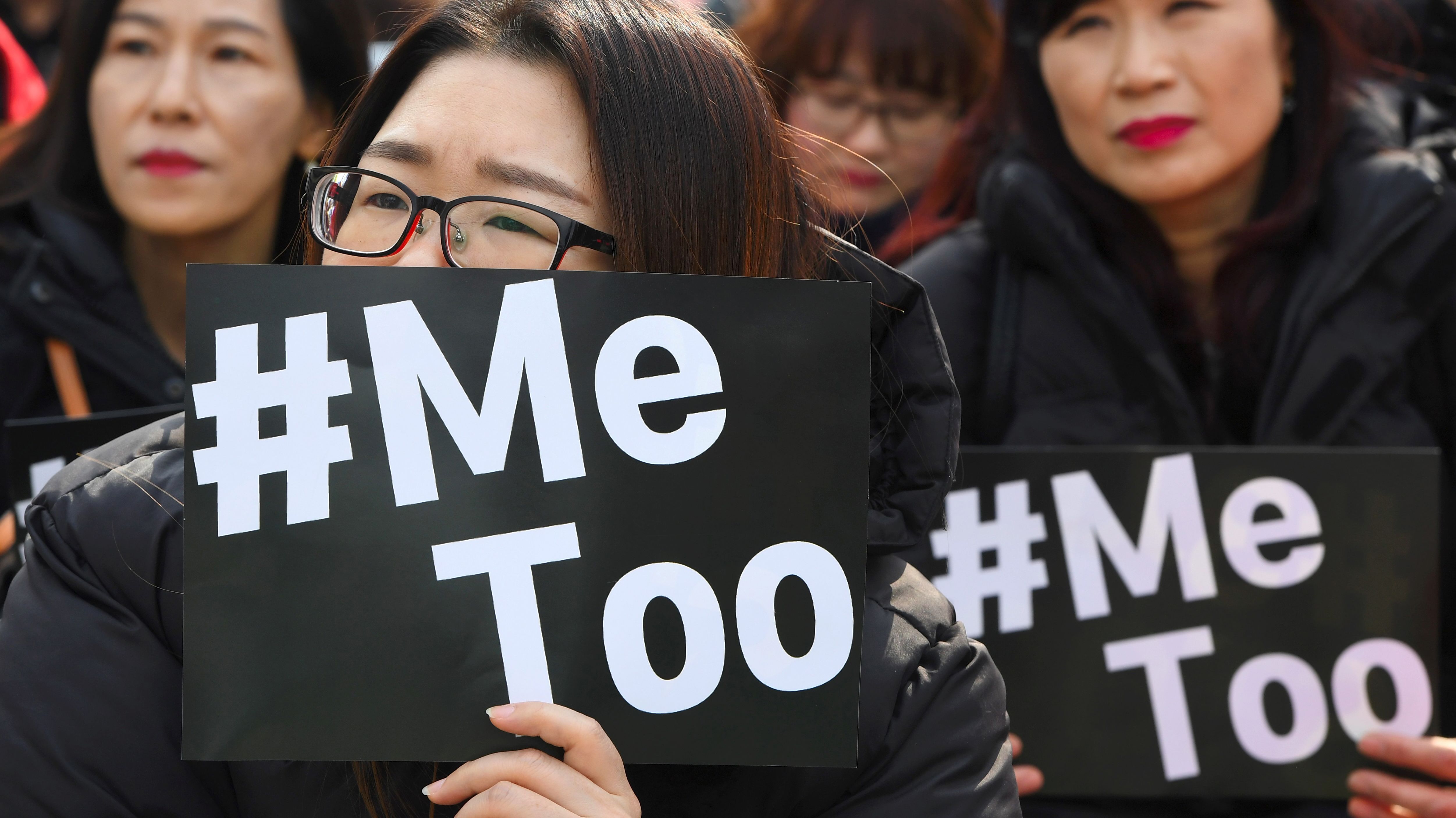 South Korean demonstrators hold banners during a rally to mark International Women's Day as part of the country's #MeToo movement in Seoul on