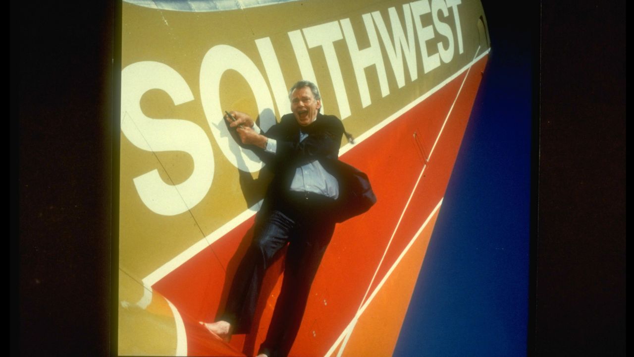 Southwest Airlines co-founder & CEO Herb Kelleher standing barefoot on wing of plane. (Photo by Pam Francis/The LIFE Images Collection/Getty Images)