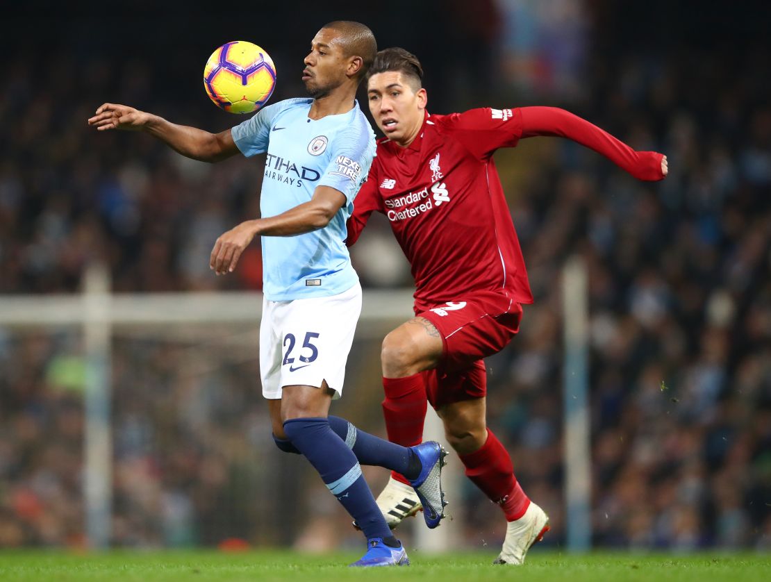 Liverpool's Roberto Firmino challenges Manchester City's Fernandinho during City's 2-1 win in January. 