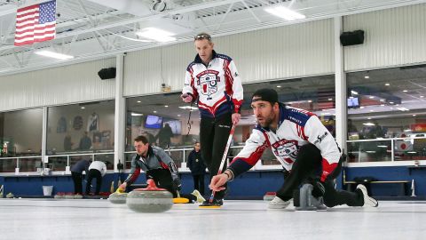 Allen, right, practices with his curling team for a competition as coach and former Olympian John Benton watches in Blaine, Minnesota.