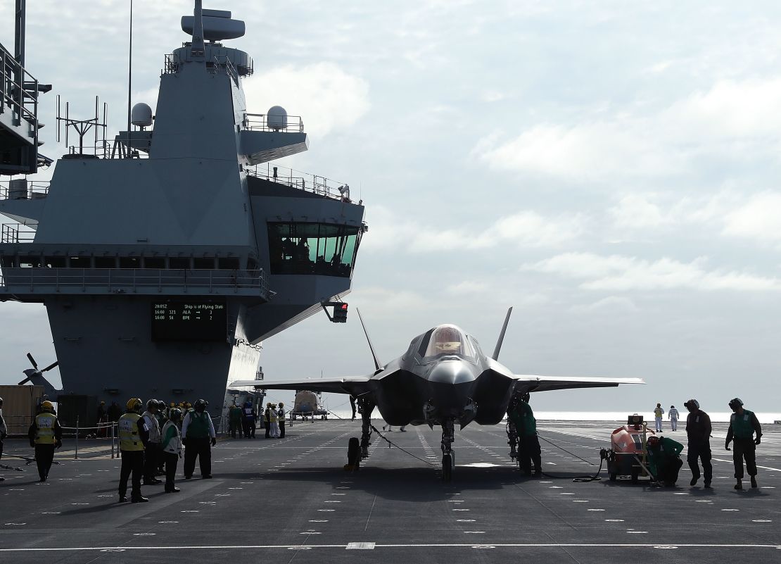 A new F-35B fighter jet is prepped for take off from the deck of the United Kingdom's aircraft carrier HMS Queen Elizabeth in 2018. The jet's electronics enable close coordination between allied air forces.