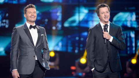 Then-host Ryan Seacrest and Brian Dunkleman speak onstage during "American Idol" finale for its farewell season at Dolby Theatre on April 7, 2016 in Hollywood, California. 