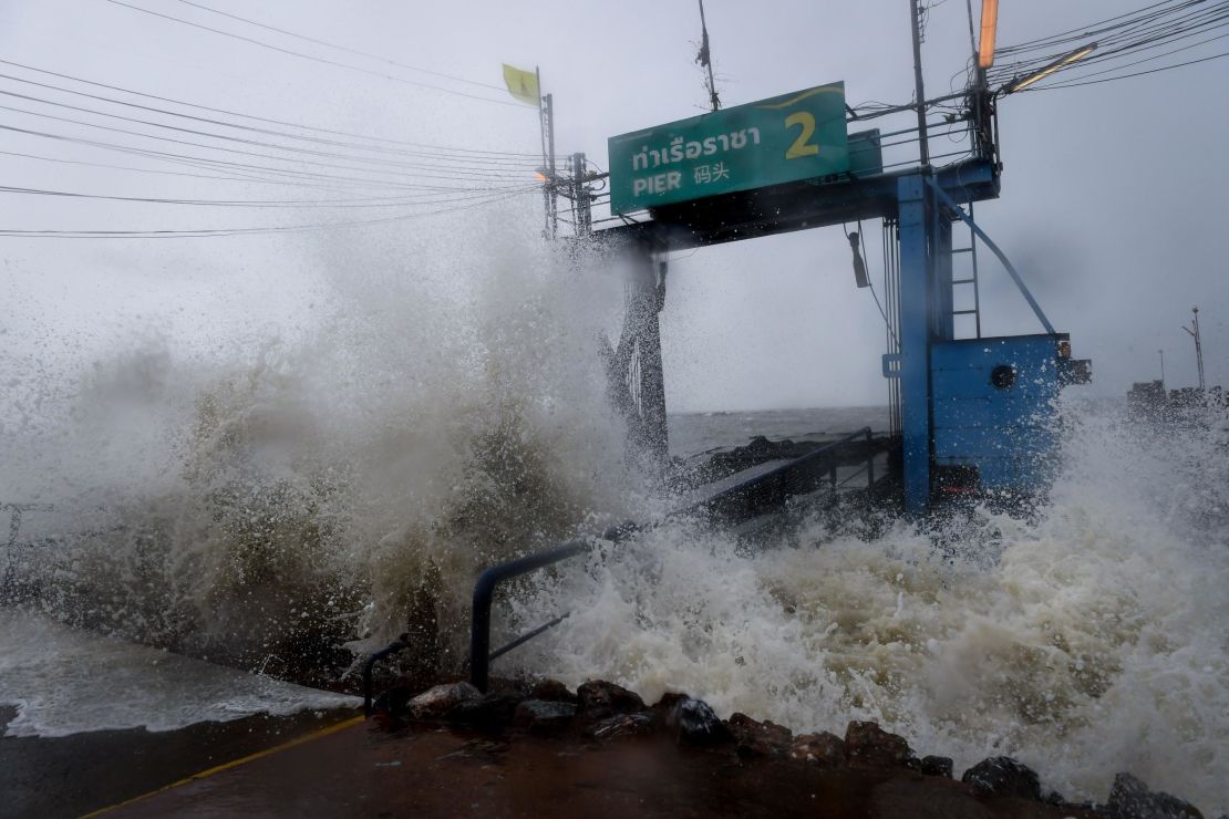 Waves crash into a pier in the southern Thai province of Surat Thani on Friday.