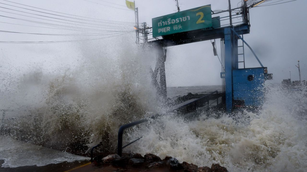 Waves crash into a pier in the southern Thai province of Surat Thani on Friday.