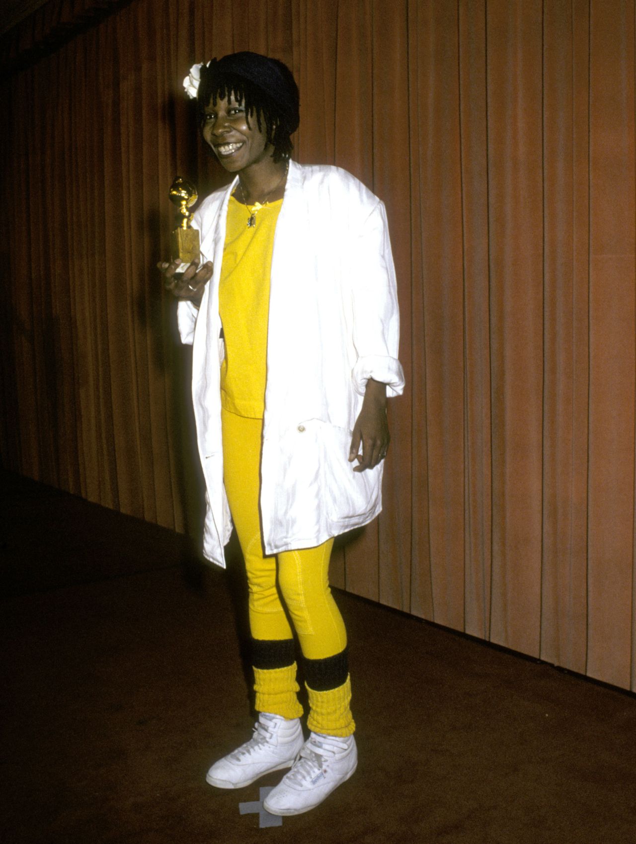 W is for Whoopi: Whoopi Goldberg took home a Golden Globe in 1986 for her performance in "The Color Purple." And she secured her place in the awards' fashion history with one of the red carpet's oddest looks, combining a white blazer with yellow leggings, leg-warmers and a pair of white Reebok sneakers. 